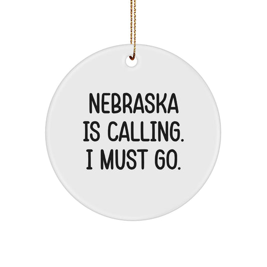 Funny Nebraska Gifts from Friends for Men and Women - Christmas Circle Ornament 'Nebraska Is Calling. I Must Go.' - Image 1