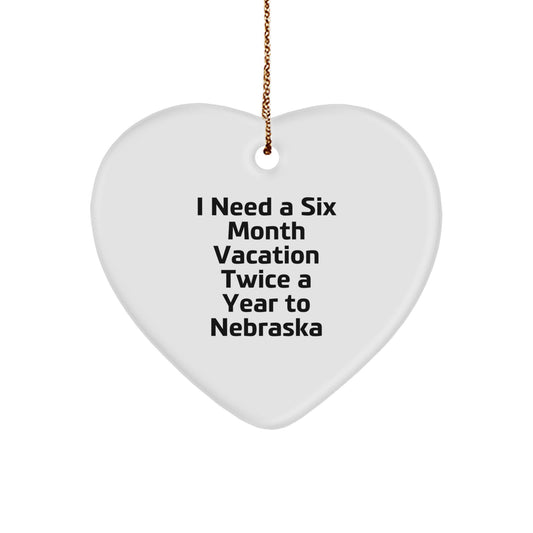 Gifts from Friends for Nebraska Lovers, 'I Need A Six Month Vacation Twice A Year To Nebraska' Funny Heart Ornament for Christmas - Image 1